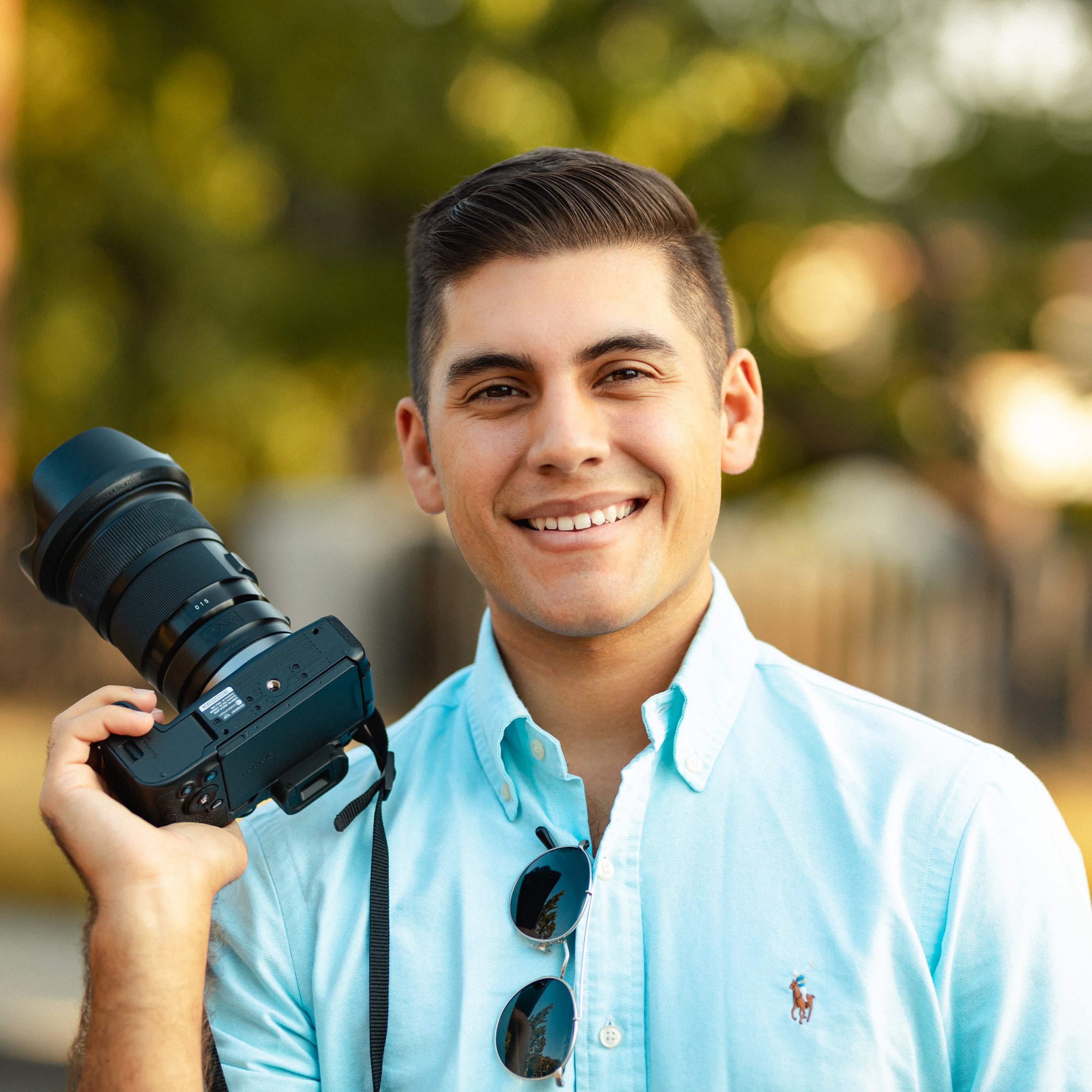 Jay holding a camera
